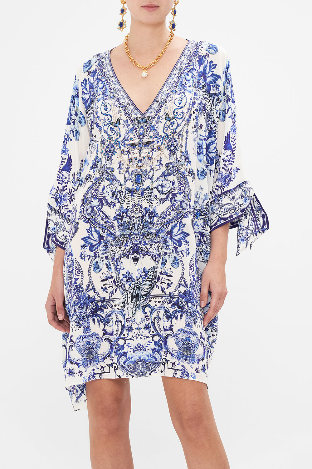 Crop view of model wearing CAMILLA silk kaftan in Glaze and Graze print