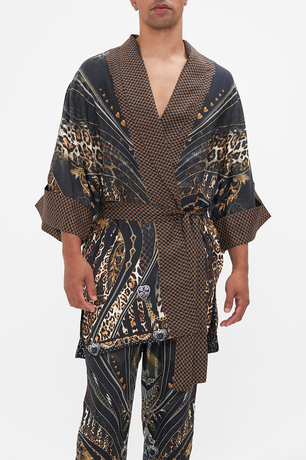 Crop view of model wearing Hotel Franks by CAMILLA mens silk robe in Chaos In The Cosmos animal print