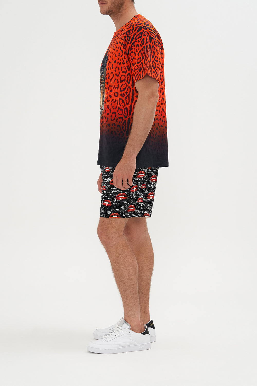 Side view of model wearing Hotel Franks by CAMILLA mens relaxed fit tee in Chaos Magic graphic print