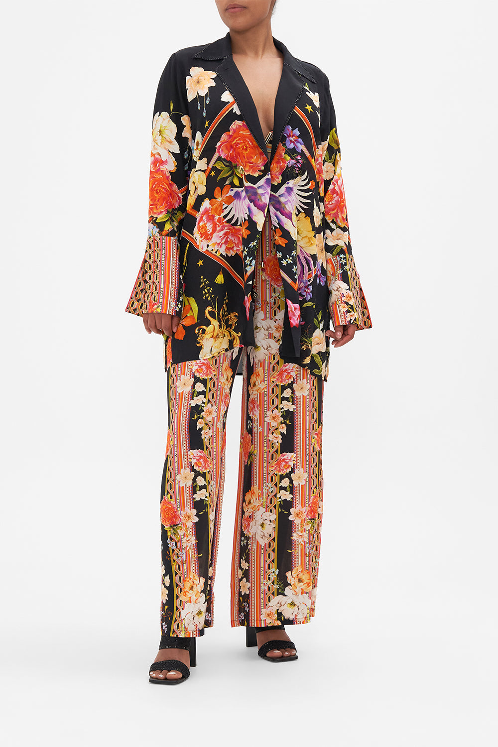 Front view of model wearing CAMILLA silk jacket in Secret History floral print