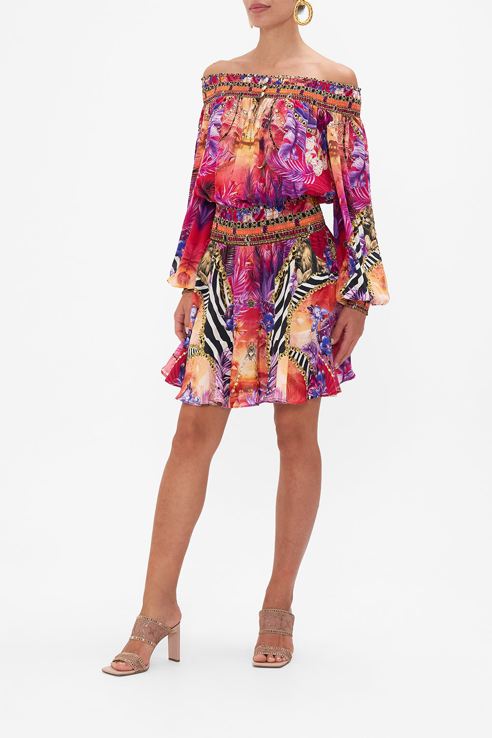 Side view of model wearing CAMILLA silk off the shoulder dress in Wild Loving print