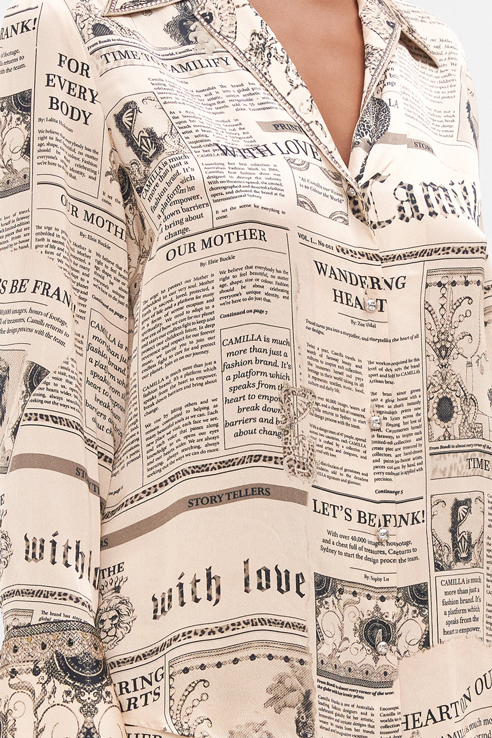 Detail view of model wearing CAMILLA pink silk pyjama shirt in Fame Fever print