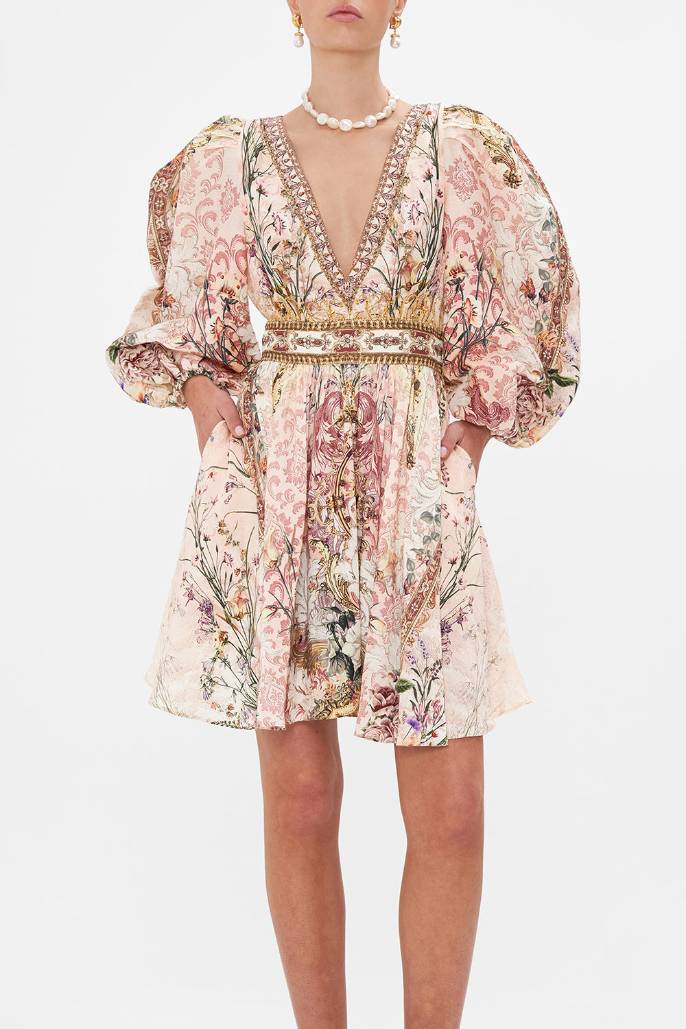 Crop view of model wearing CAMILLA floral mini dress in Kissed By The Prince print