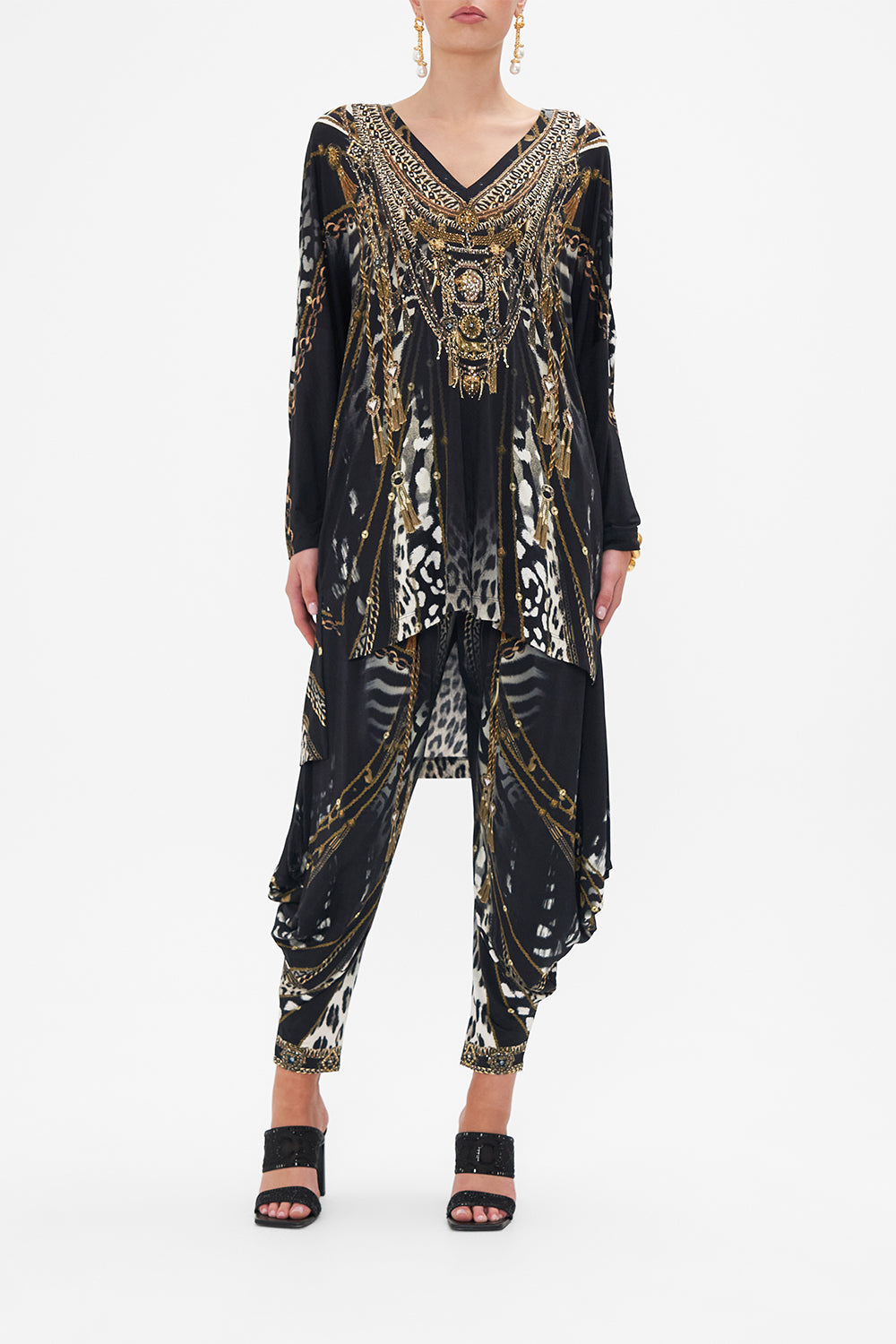 Front view of model wearing CAMILLA black and white animal print long sleeve top in Untamed Royalty print