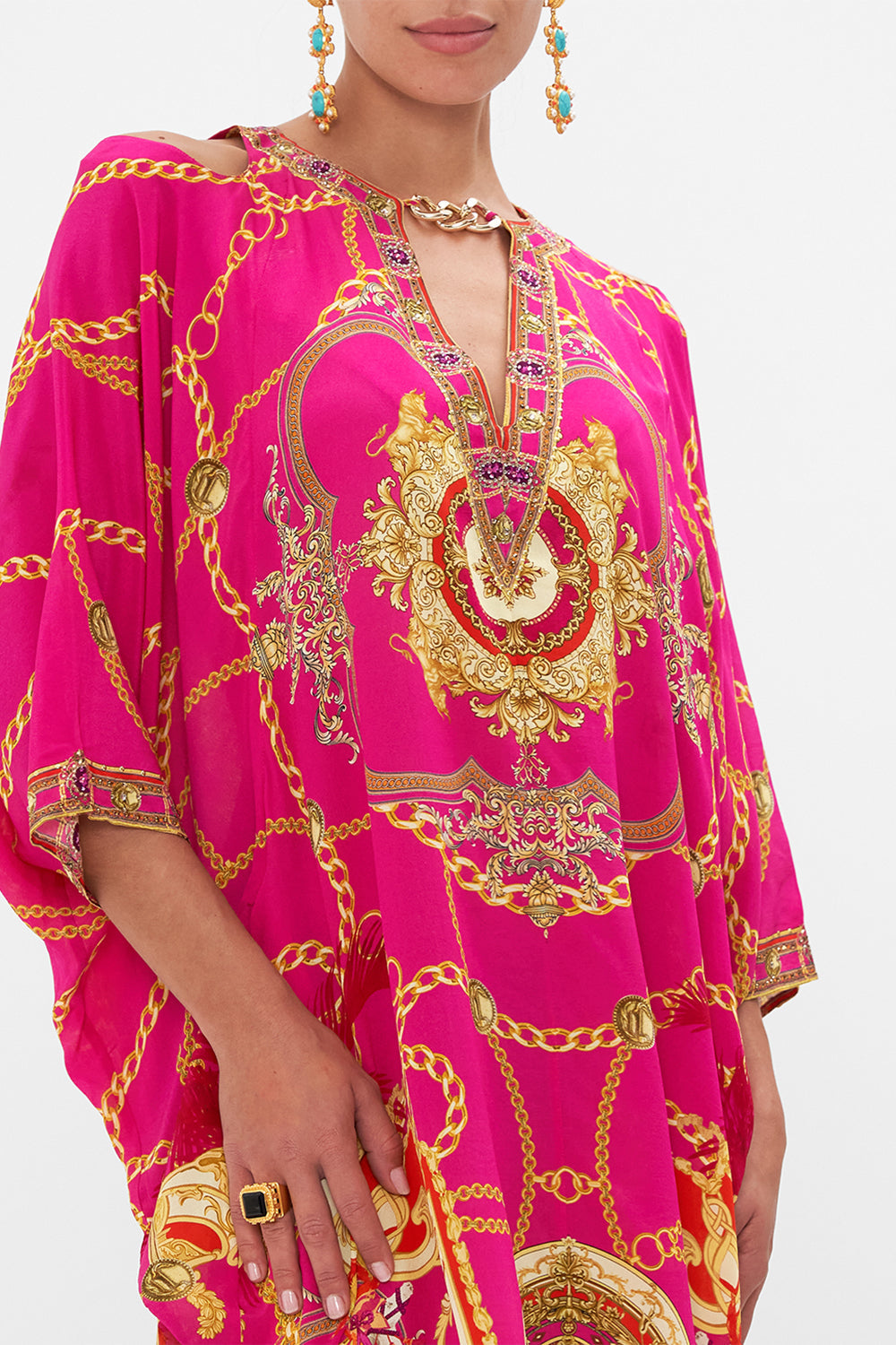 Detail view of model wearing CAMILLA pink silk kaftan in Wild And Running print
