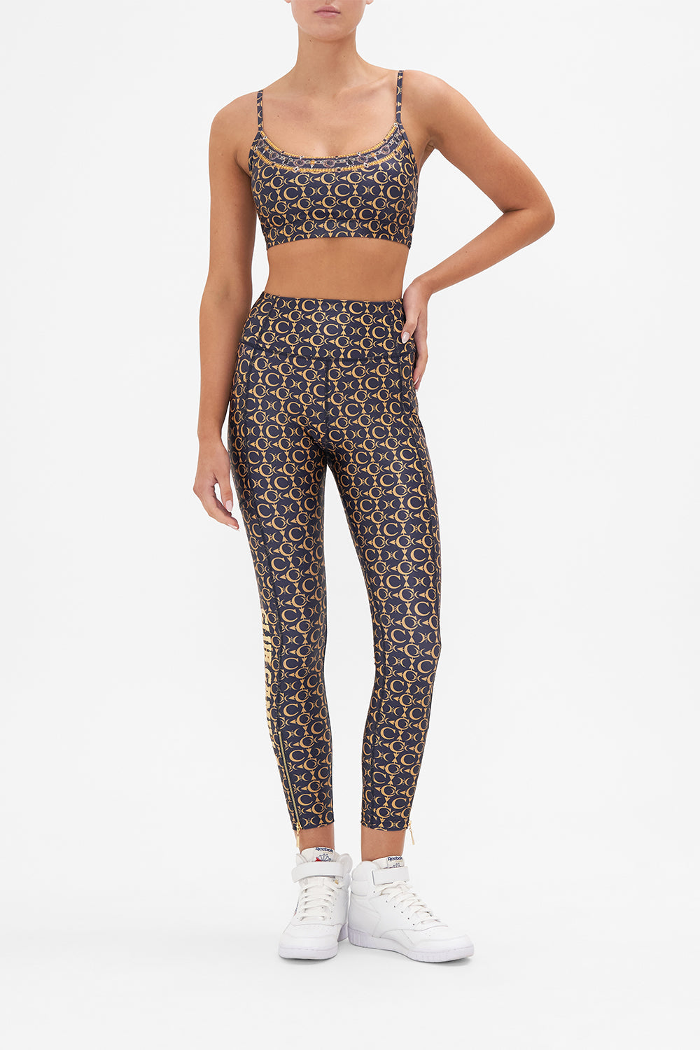 Front view of model wearing CAMILLA leggings in Song Of The Jungle print