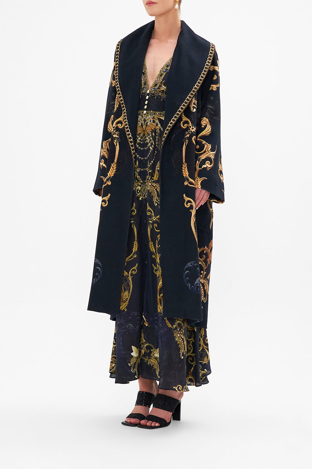 Side view of model wearing CAMILLA long wool coat in Moonlight Melodies print