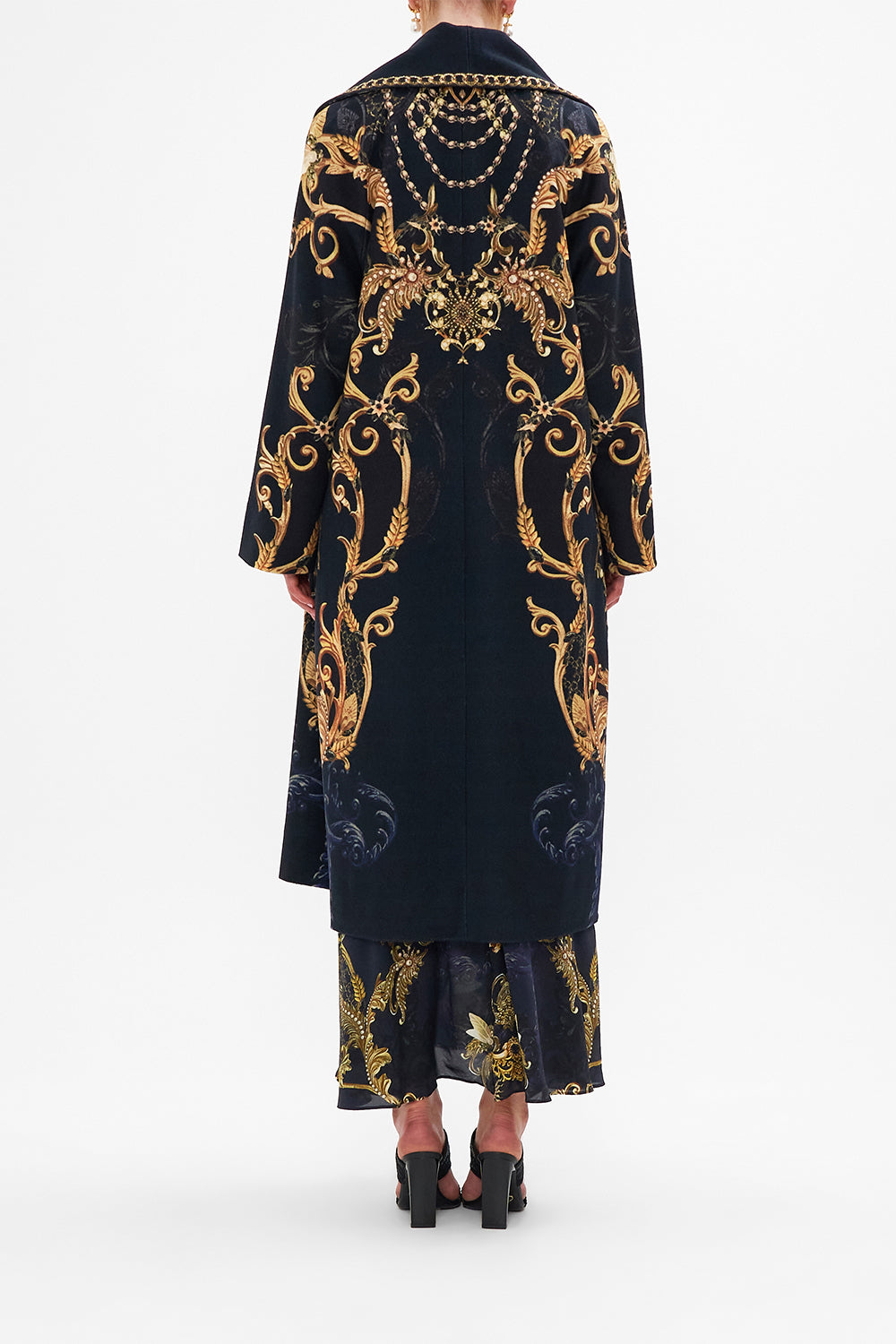 Back view of model wearing CAMILLA long wool coat in Moonlight Melodies print