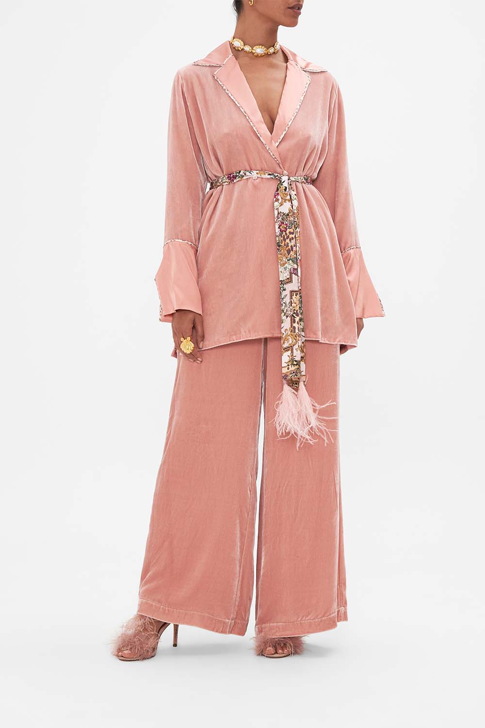 Front view of model wearing CAMILLA pink jacket in Bambino Bliss print