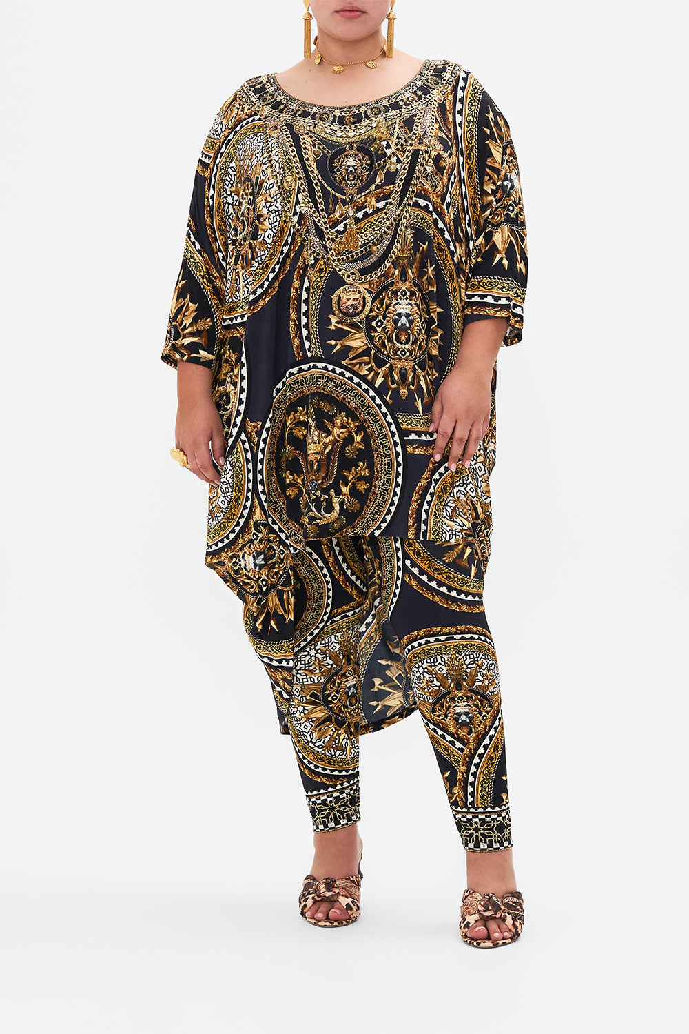 Front view of curvy model wearing CAMILLA plus size jersey tunic dress in Duomo Kaleido print