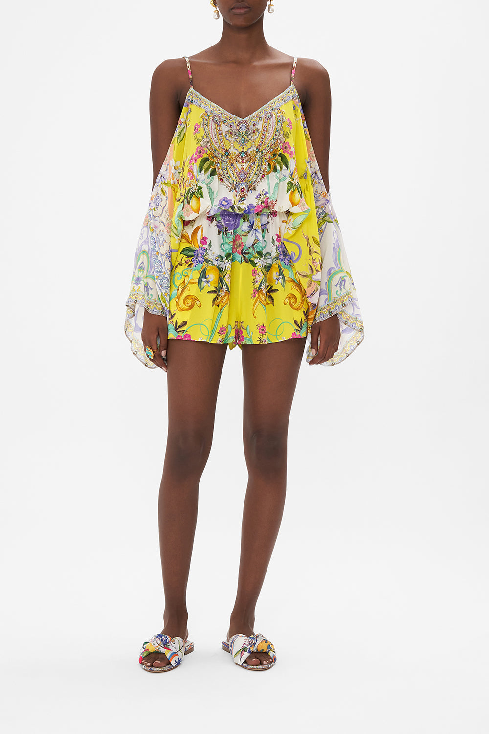 Front view of model wearing CAMILLA silk drop shoulder playsuit in Caterina Spritz print