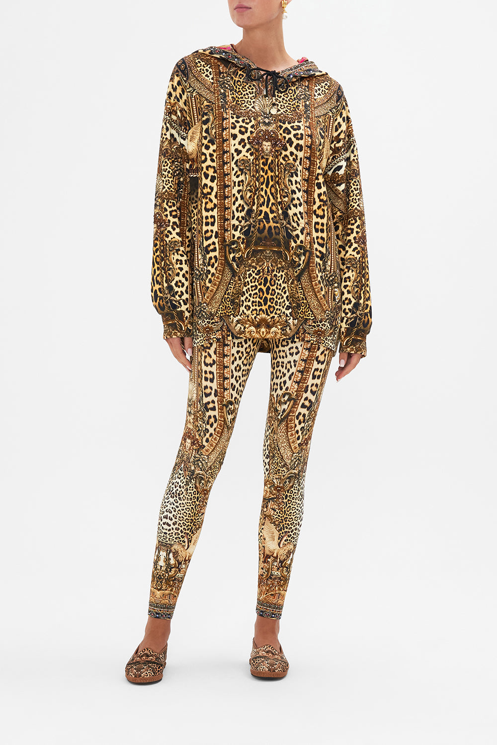 Front view of model wearing CAMILLA leopard print hoodie in Standing Ovation print