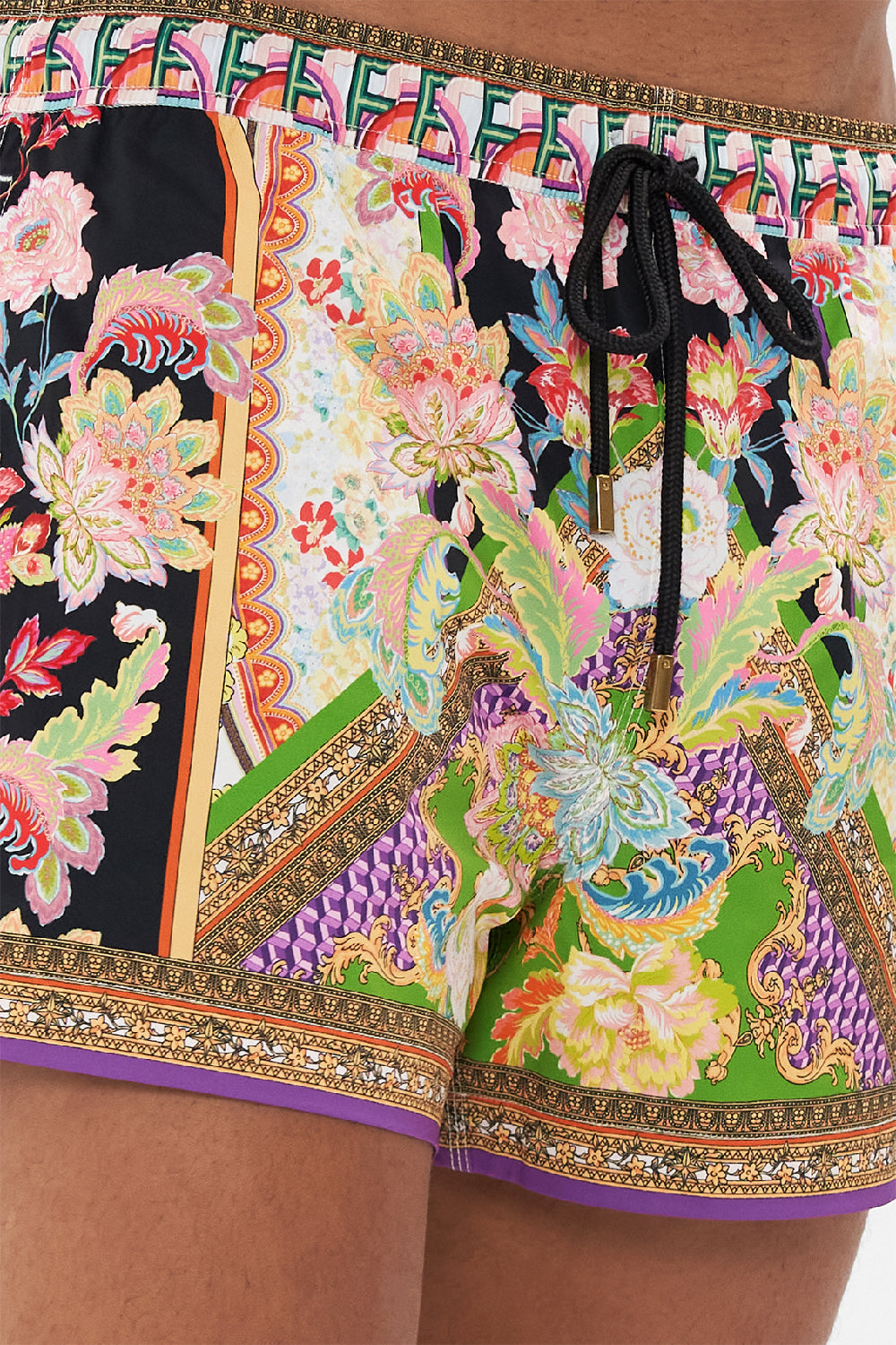 Detail view of model wearing Hotel Franks by CAMILLA mens swim short in Sundowners In Sicily print