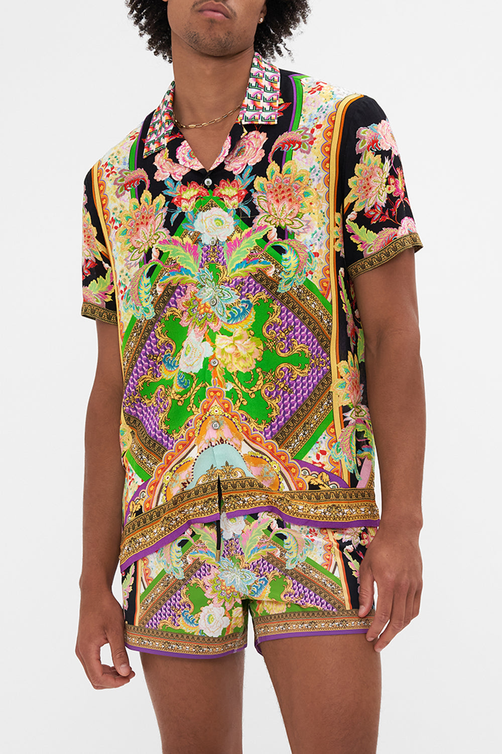 Crop view of model wearing Hotel Franks by CAMILLA mens short sleeve camp collared shirt in Sundowners in Sicily print