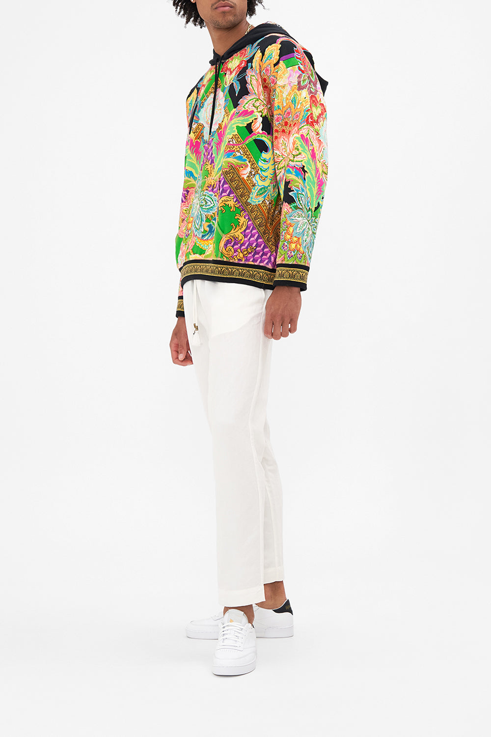 Side view of model wearing Hotel Franks By CAMILLA mens oversized hoodie in Sundowners in Sicily print