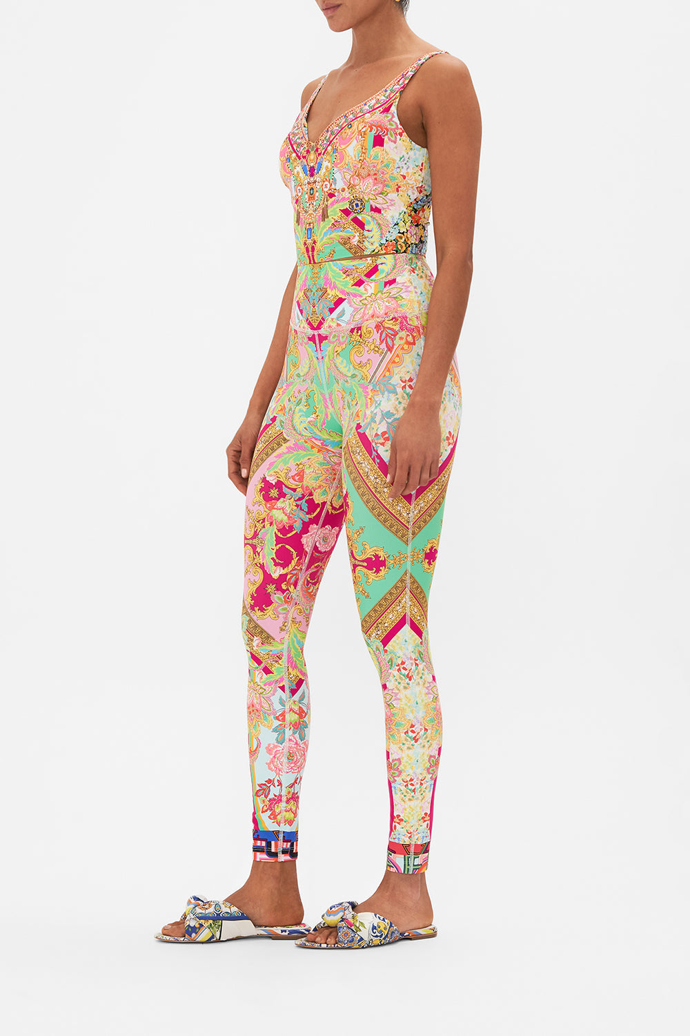 Side view of model wearing CAMILLA printed activewear crop tank in Ciao Bella print