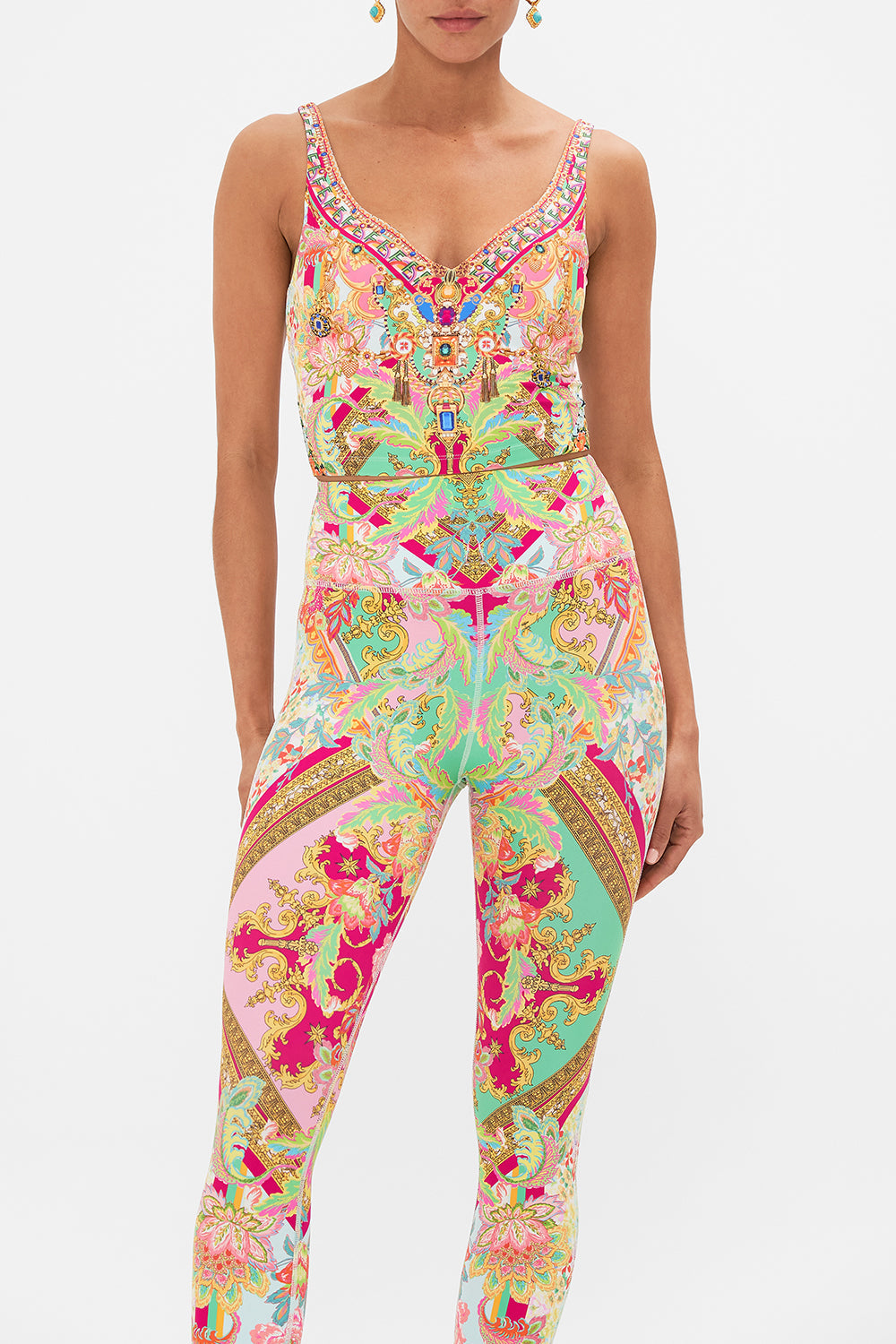 Crop view of model wearing CAMILLA printed activewear crop tank in Ciao Bella print