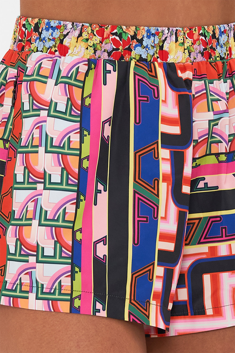 Detail view of model wearing CAMILLA printed running short in Ciao Bella print
