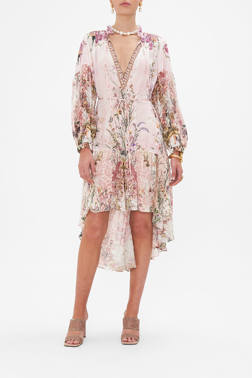 Front view of model wearing CAMILLA floral high low hem dress in Kissed By The Prince print
