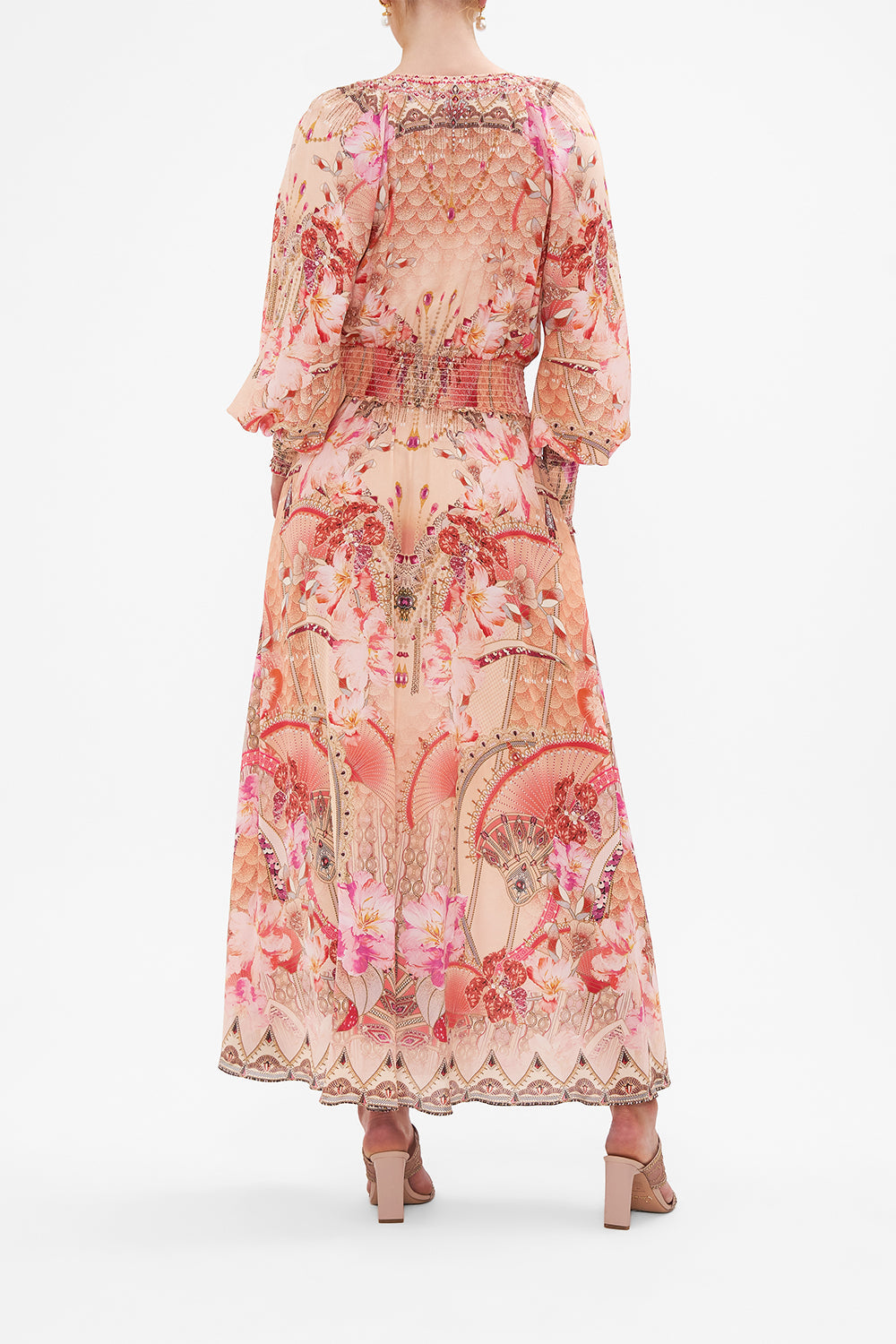 Back view of model wearing CAMILLA pink floral silk dress in Adore Me print