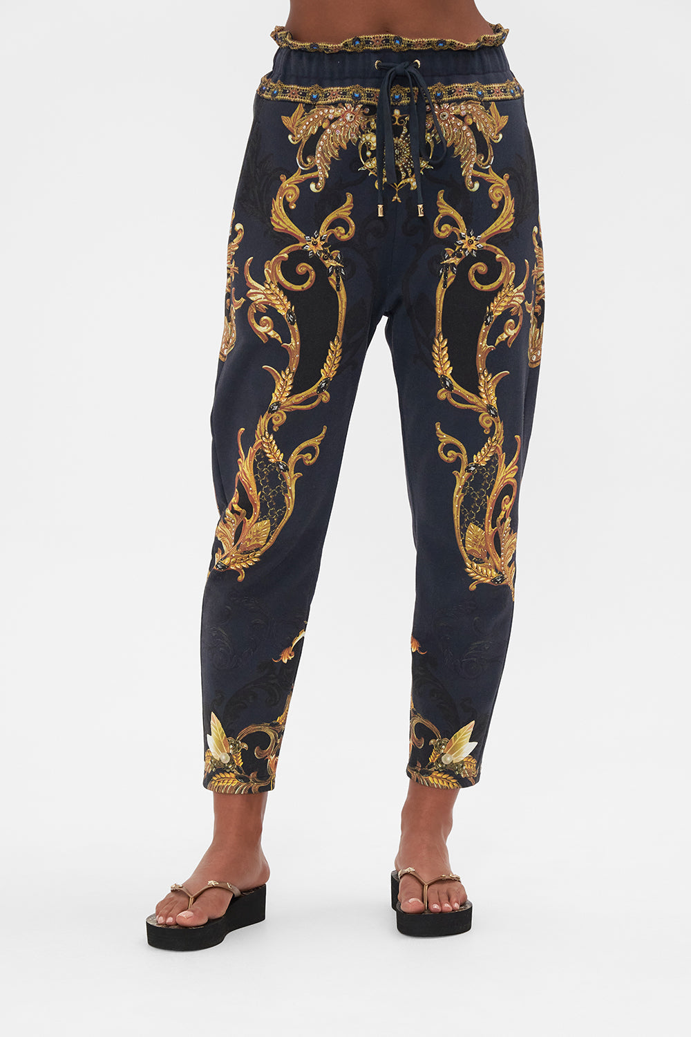 Crop view of model wearing CAMILLA trackpants in Moonlight Melodies print