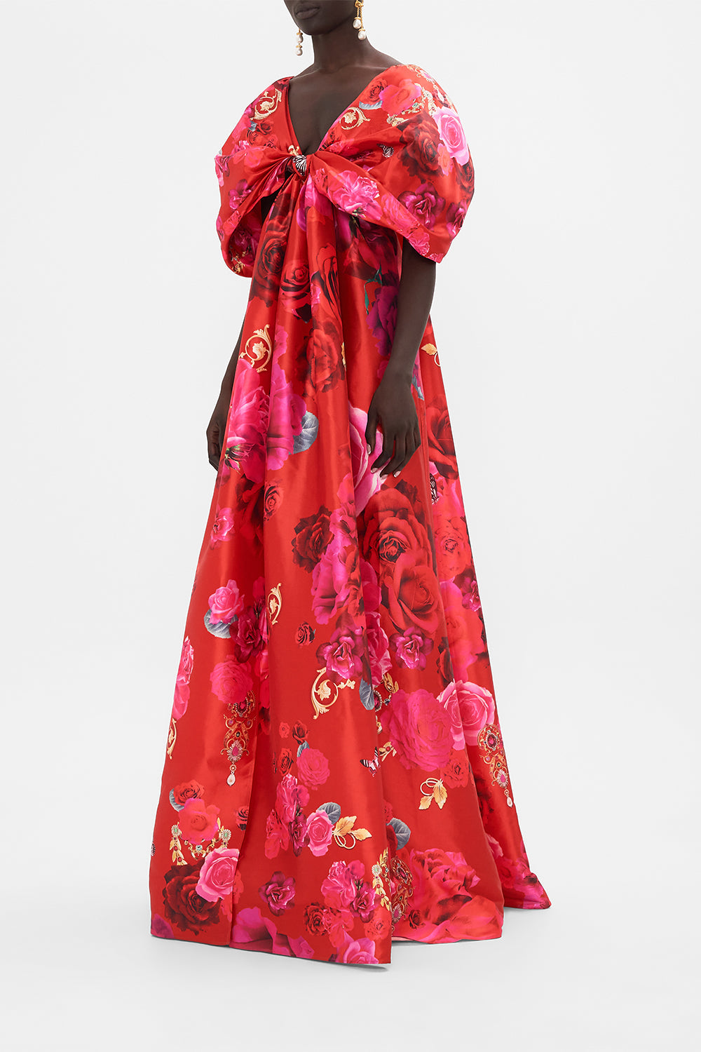 Side view of model wearing CAMILLA taffeta maxi dress with bow detail in An Italian Rosa print