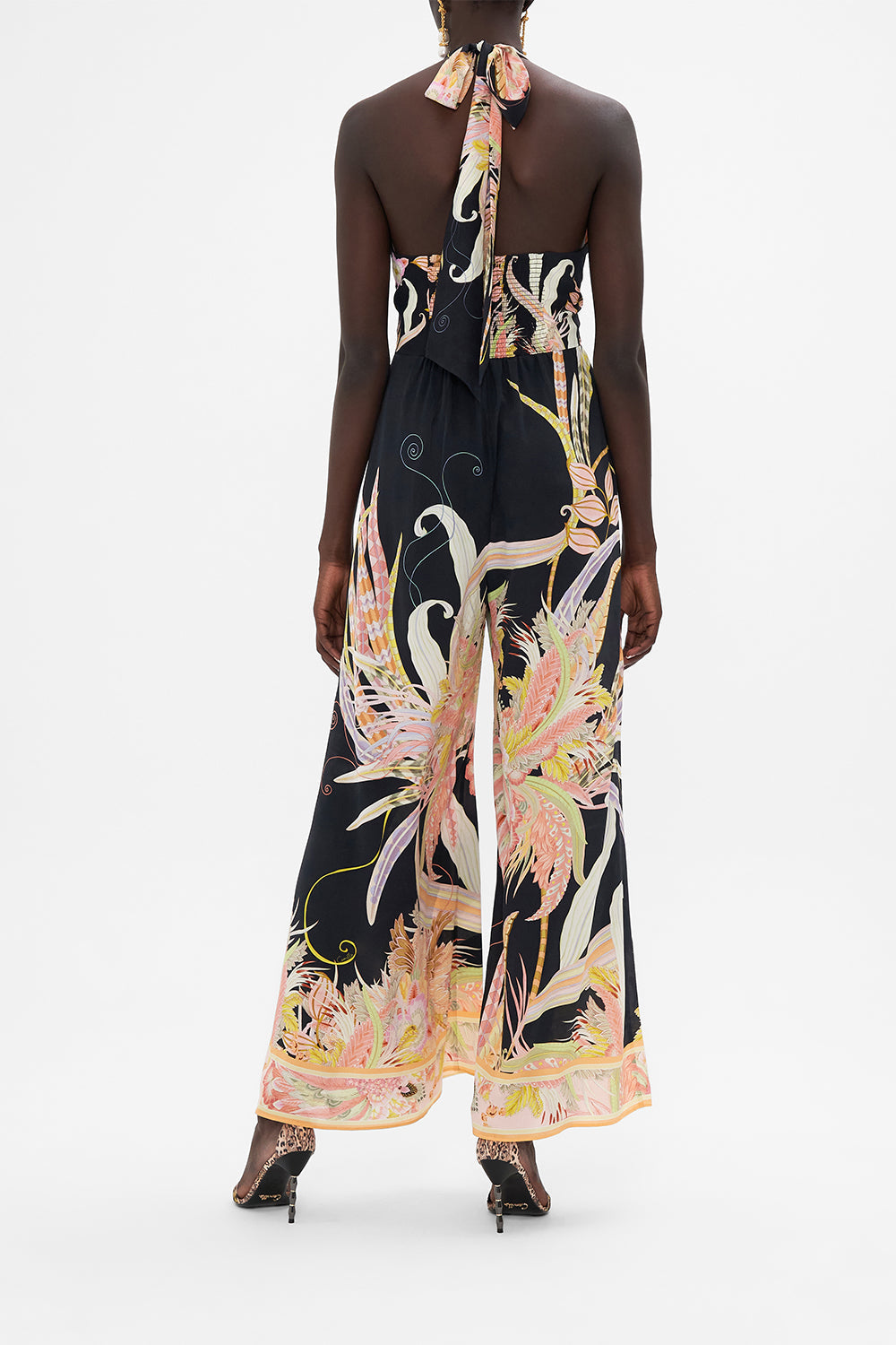 Back view of model wearing CAMILLA silk jumpsuit in Lady of The Moon print