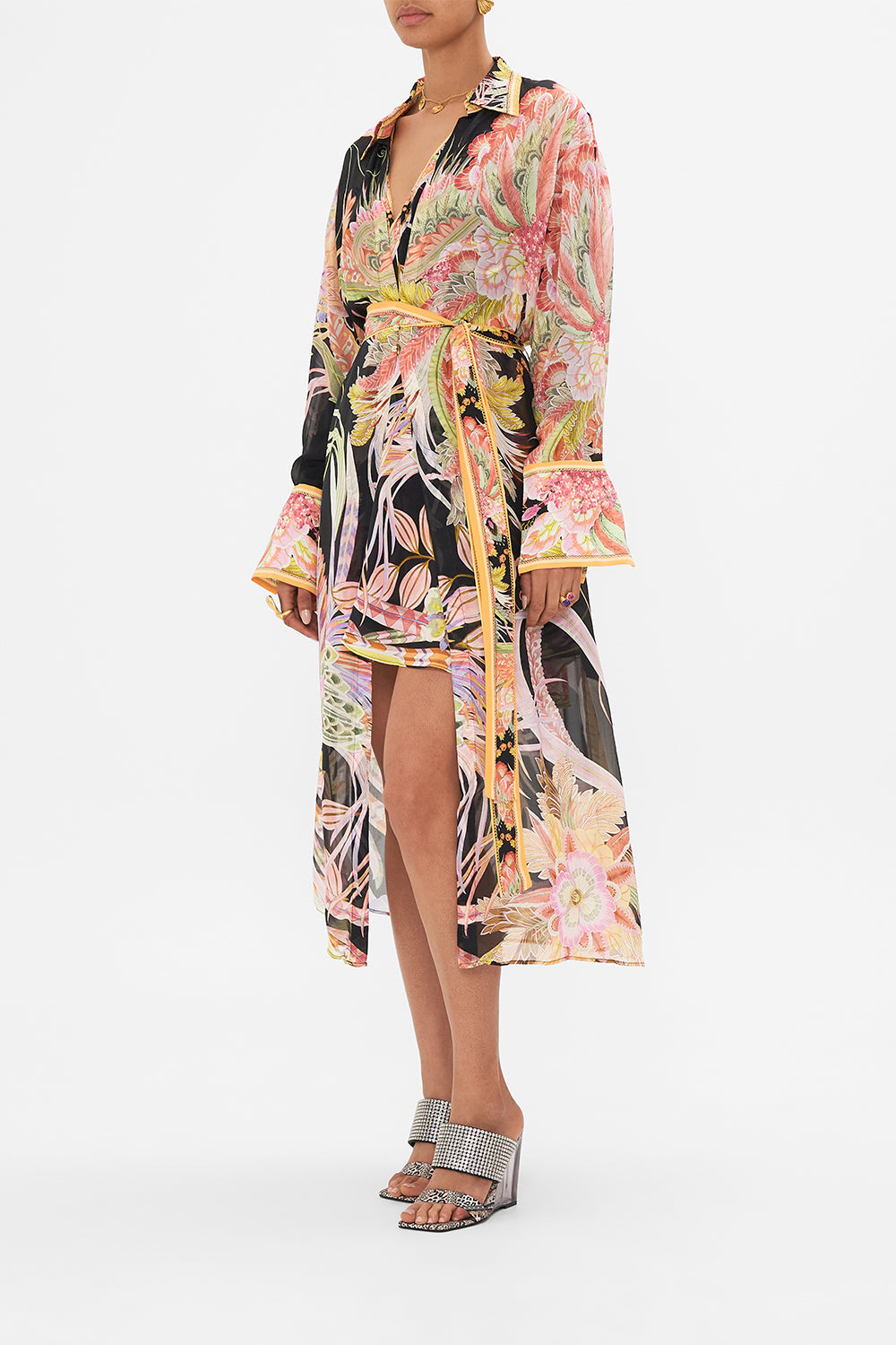 Side view of model wearing CAMILLA silk kimonop layer in Lady of the Moon print