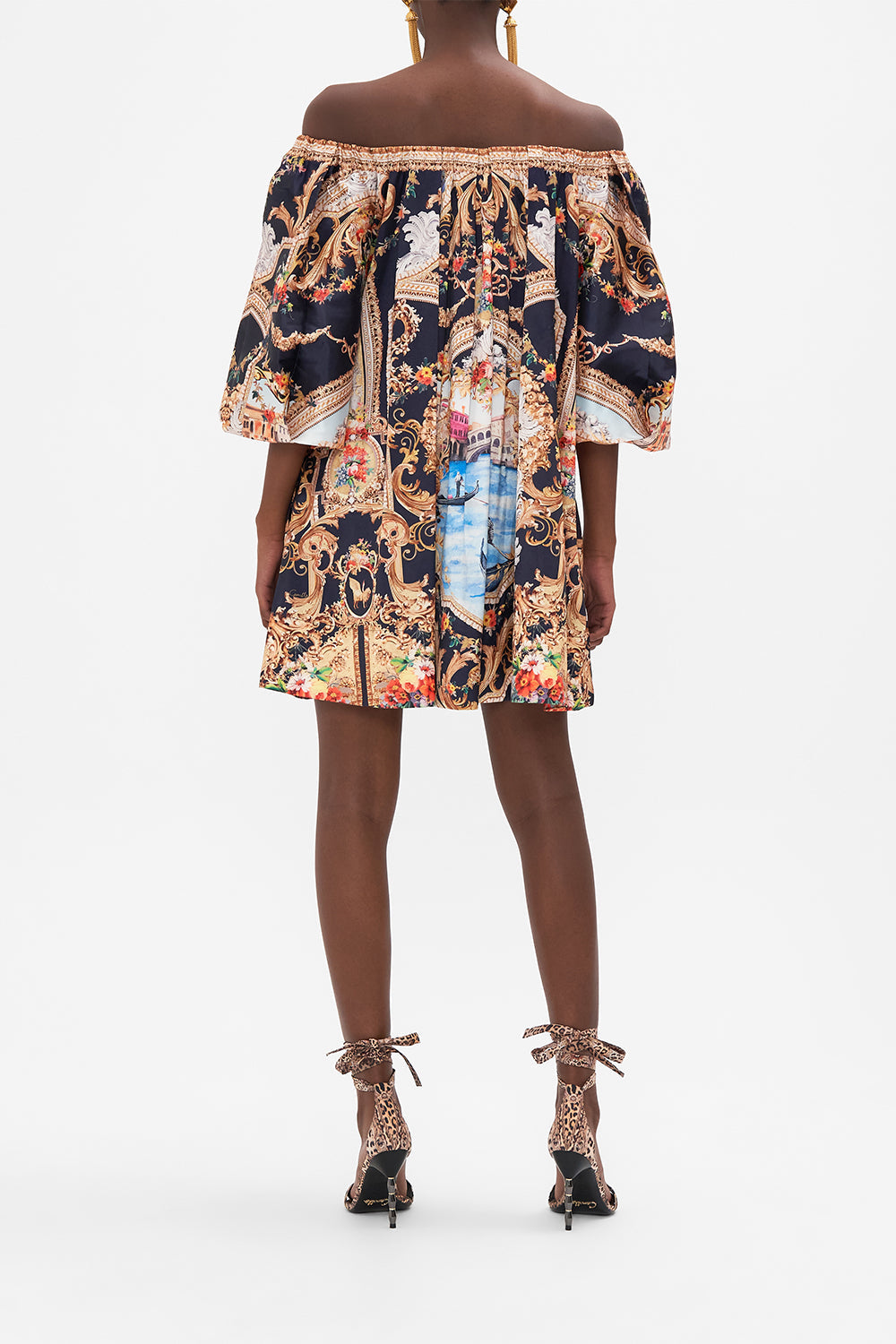 Back view of model wearing CAMILLA off the shoulder mini dress in Venice Vignette print