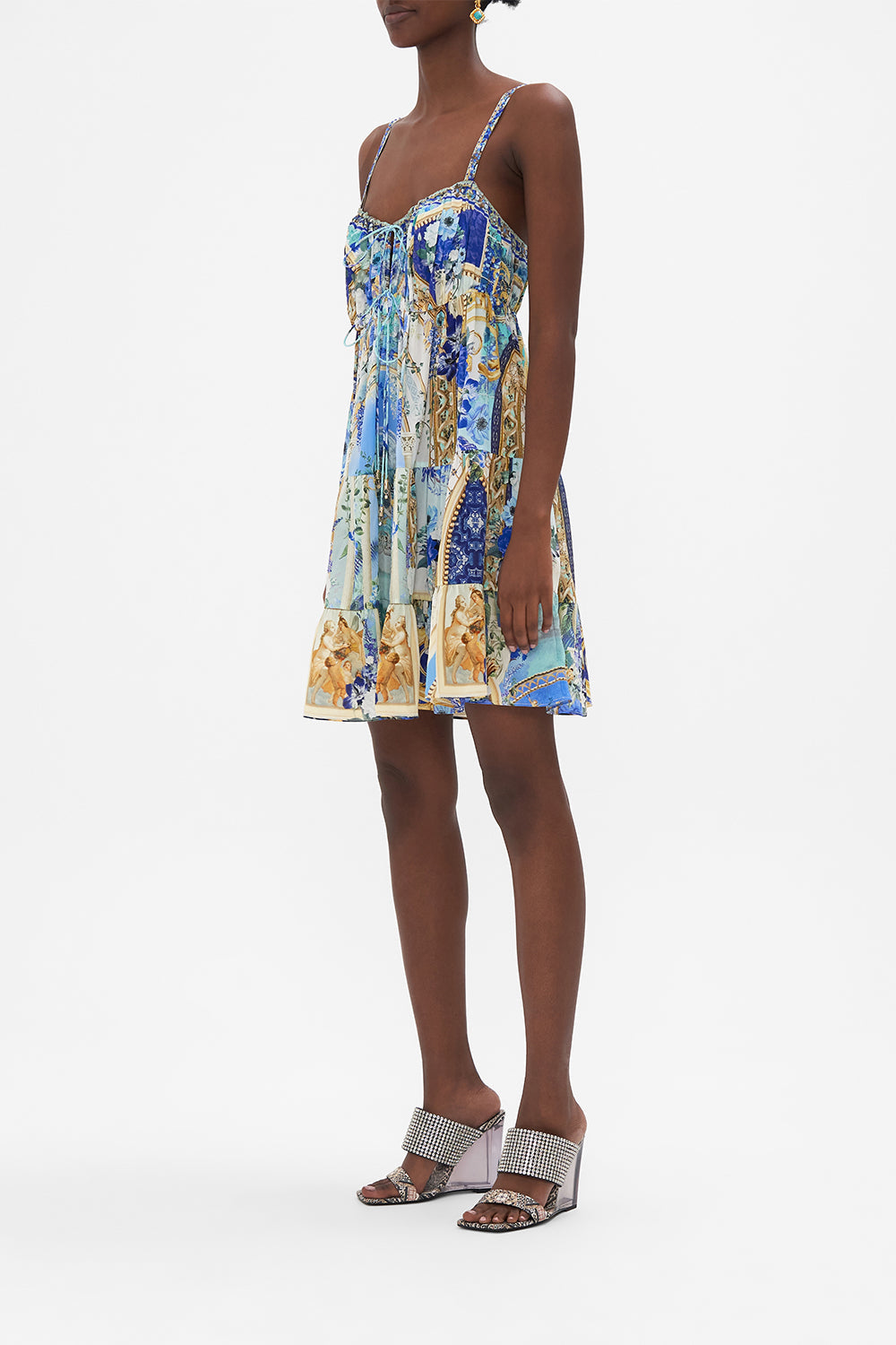 Side view of model wearing CAMILLA designer mini dress in Views Of Vesuvius Print