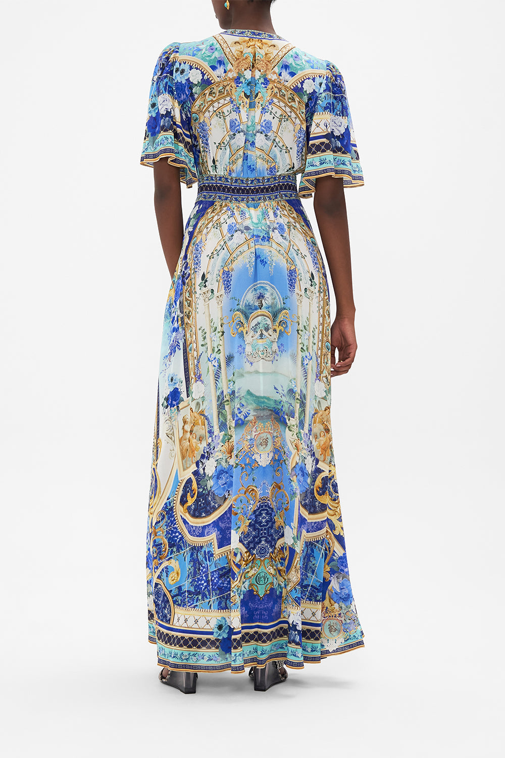 Back view of model wearing CAMILLA silk dress with flutter sleeves in Views Of Vesuvius print
