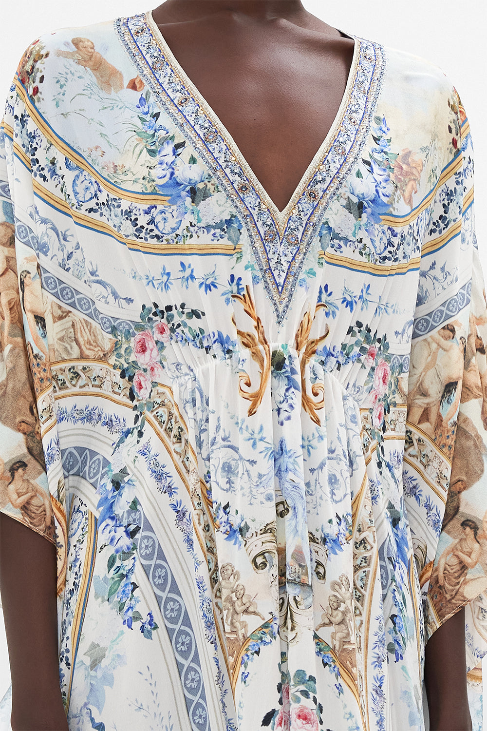 Detail view of model wearing CAMILLA silk kaftan in Season of The Siren print