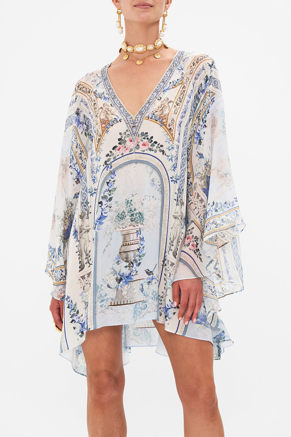 Crop view of model wearing CAMILLA silk kaftan in Season of The Siren print