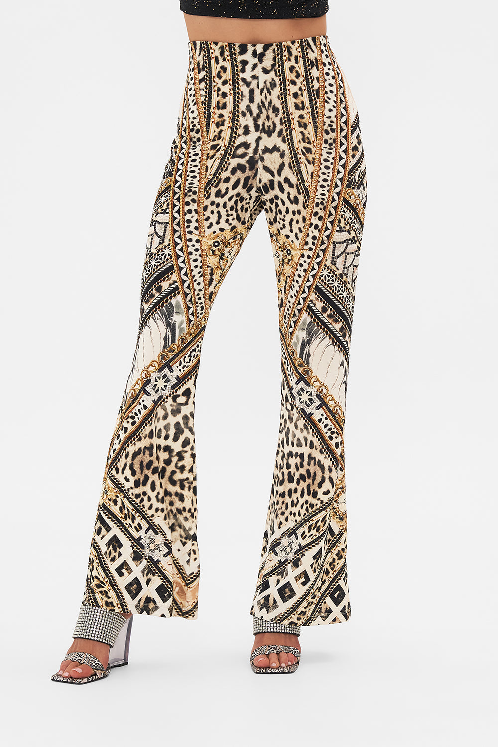 Crop view of model wearing CAMILLA flare pant in Mosaic Muse print