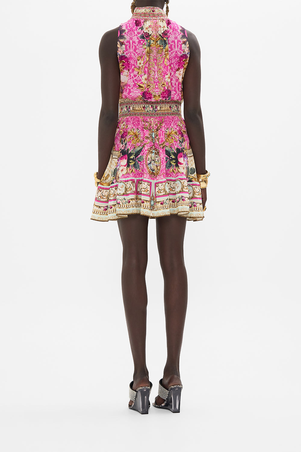Back view of model wearing CAMILLA pink silk mini dress in Call Of The Canal print
