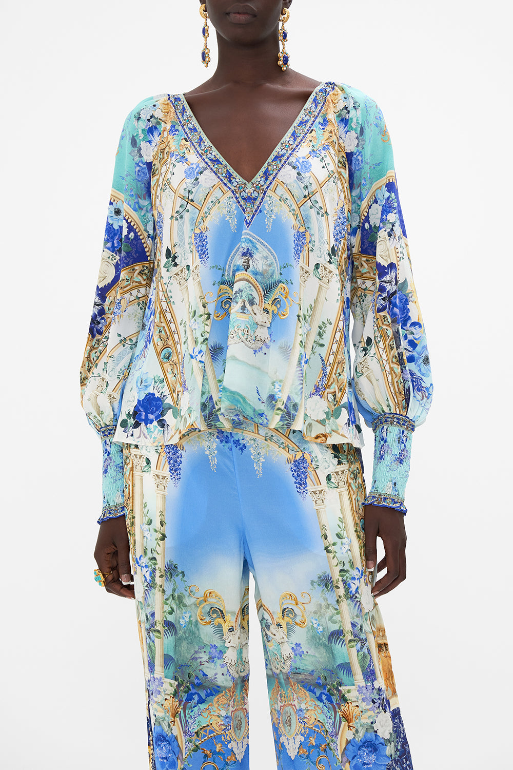 Crop view of model wearing CAMILLA silk blouse in Views Of Vesuvius print