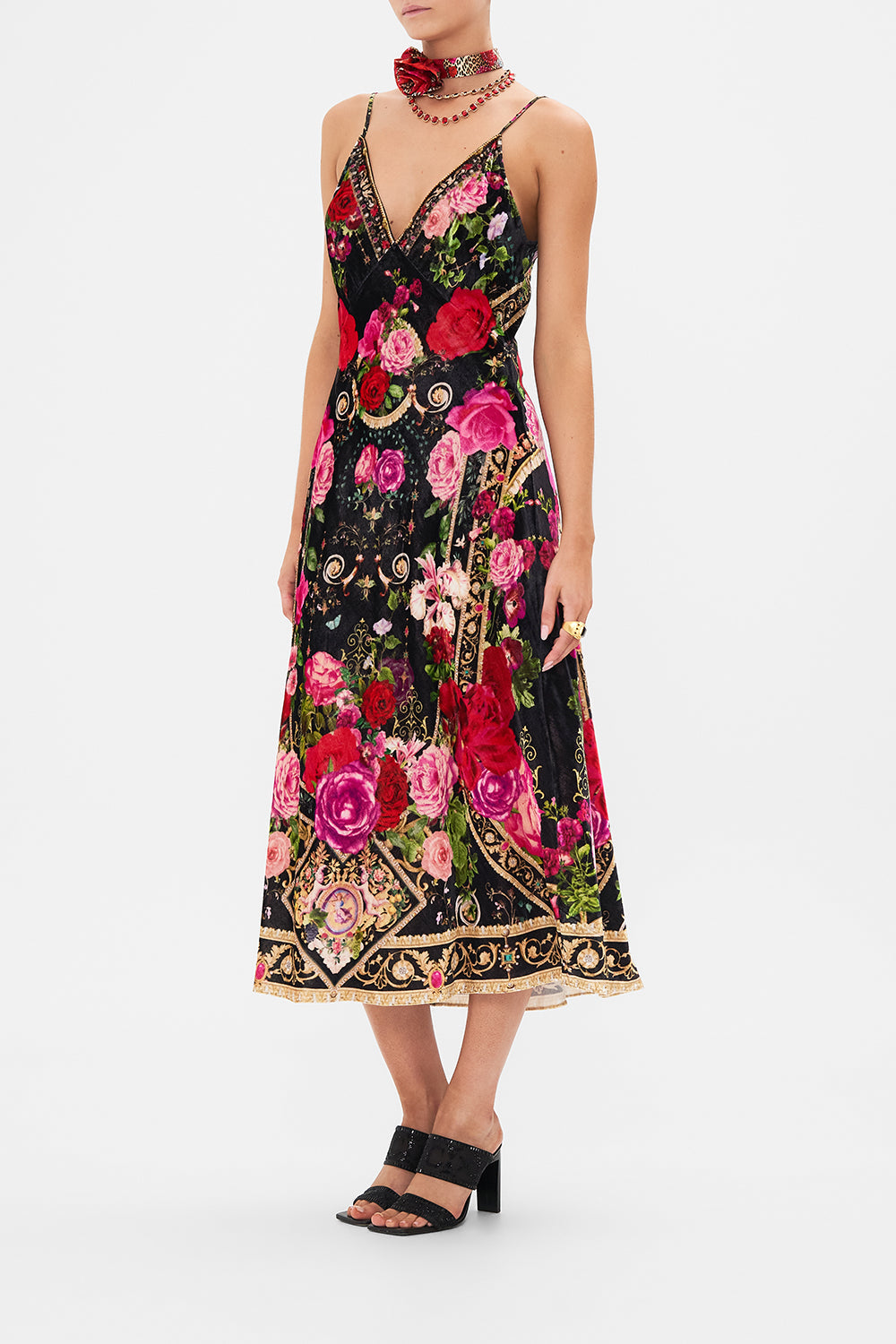 Crop view of model wearing CAMILLA velvet slip dress in Reservation For Love