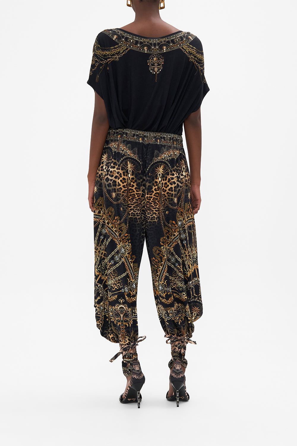 Back view of model wearing CAMILLA luxury graphic tee in Masked At Moonlight print