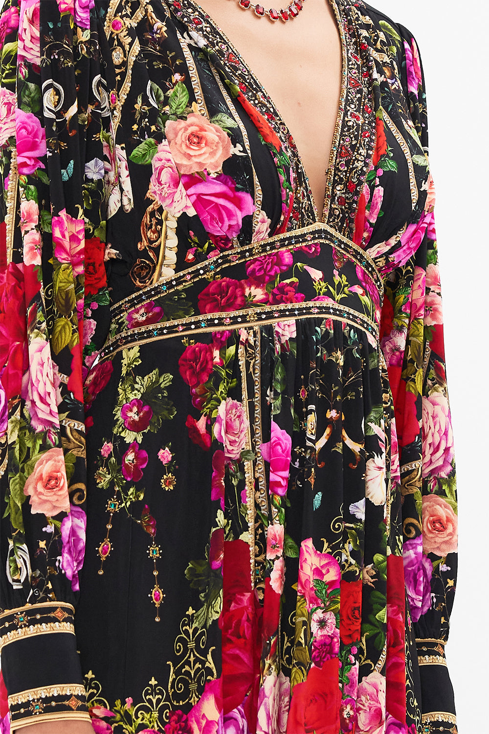 Detail view of model wearing CAMILLA jersey mini dress in Reservation For Love print