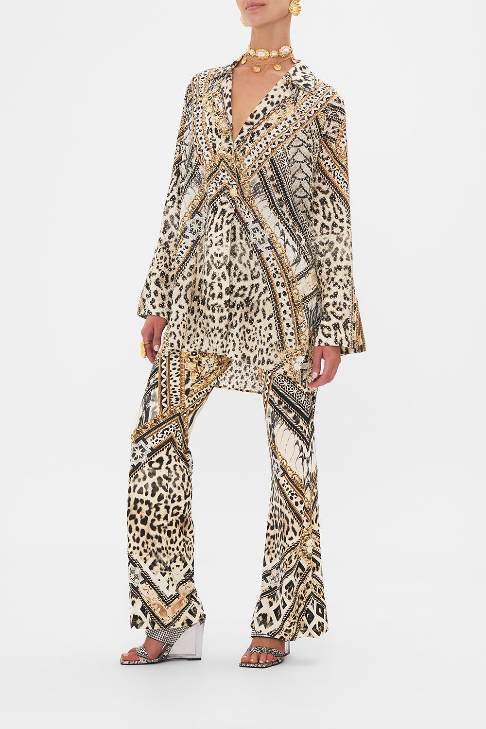 Side view of model wearing CAMILLA silk coat in Mosaic Muse print