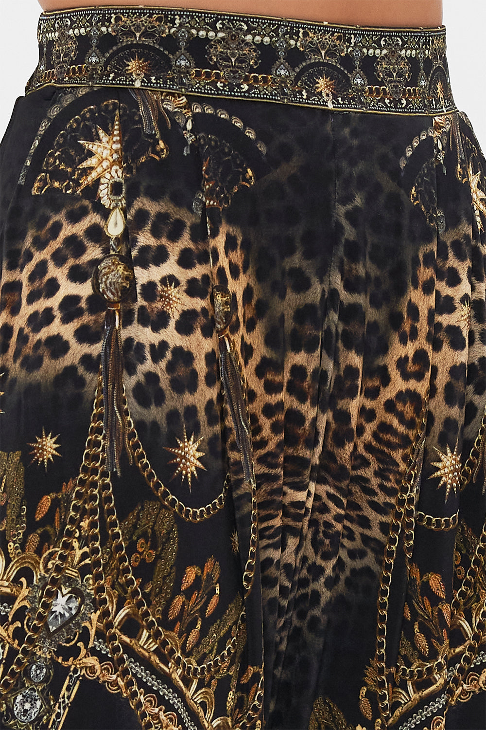 Detail view of model wearing CAMILLA jersey draped pants in Masked At Moonlight print