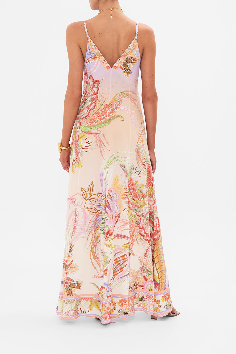 Back view of model wearing CAMILLA button through silk dress in Cosmic Tuscan print