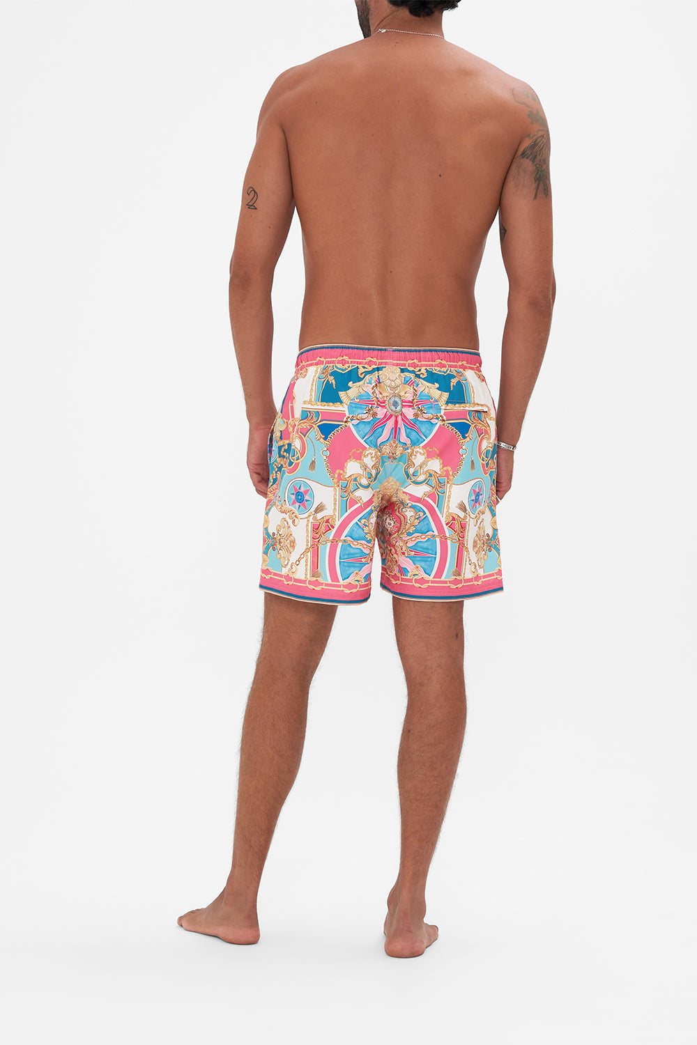 Back view of model wearing Hotel Franks by CAMILLA designer boardshorts in Sail Away With Me print