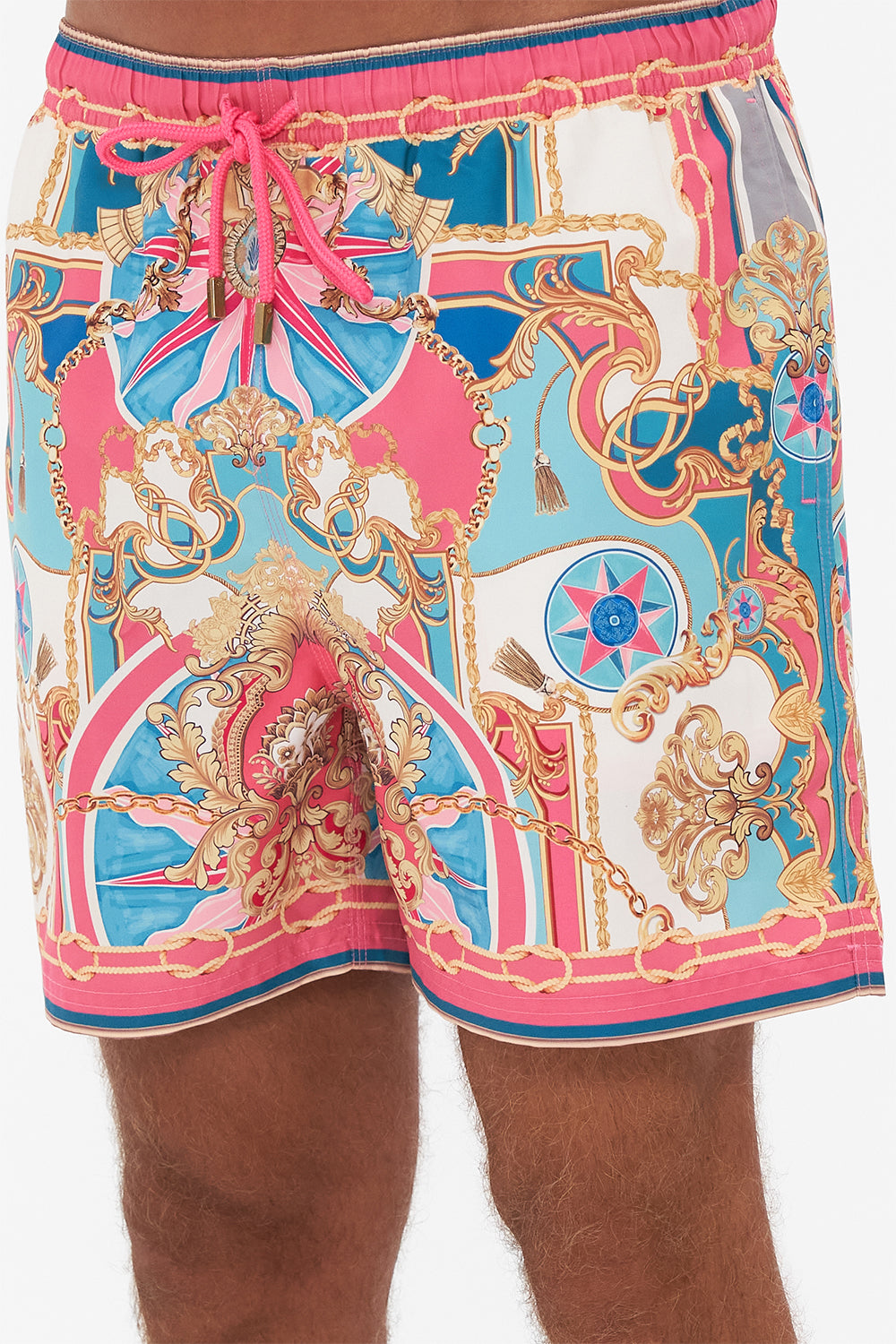 Detail view of model wearing Hotel Franks by CAMILLA designer boardshorts in Sail Away With Me print