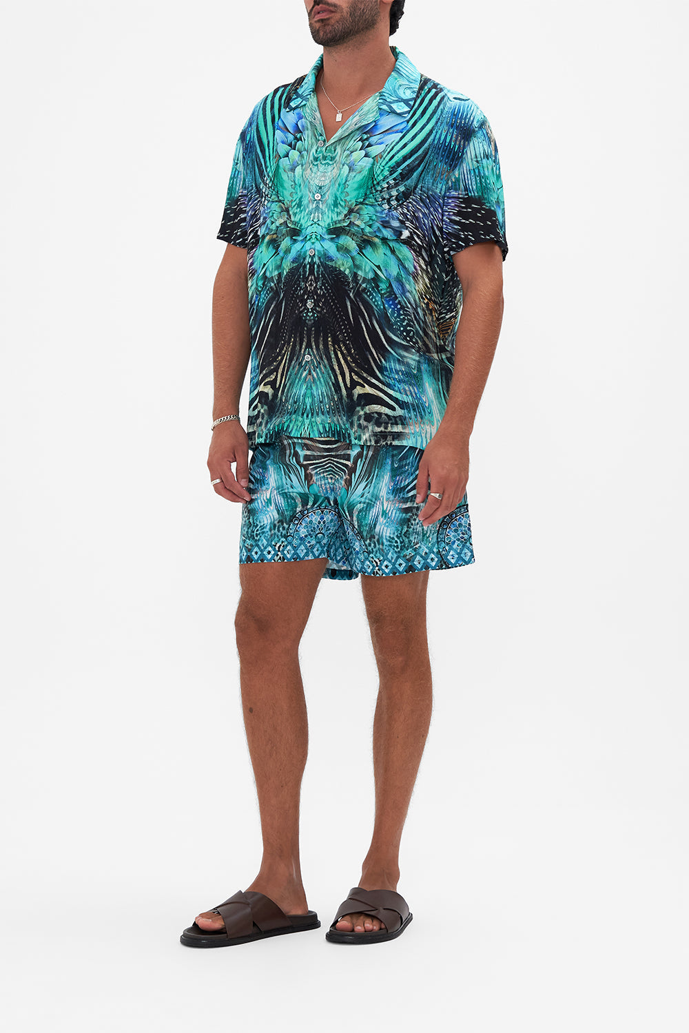 Side view of model wearing Hotel Franks By CAMILLA mens short sleeve camp collared shirt in Azure Allure