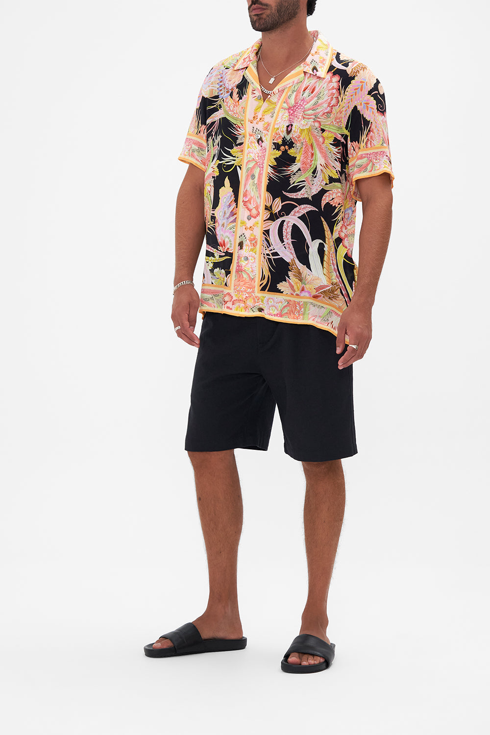 Side view of model wearing Hotel Franks by CAMILLA mens camp collared shirt in Lady of the Moon print