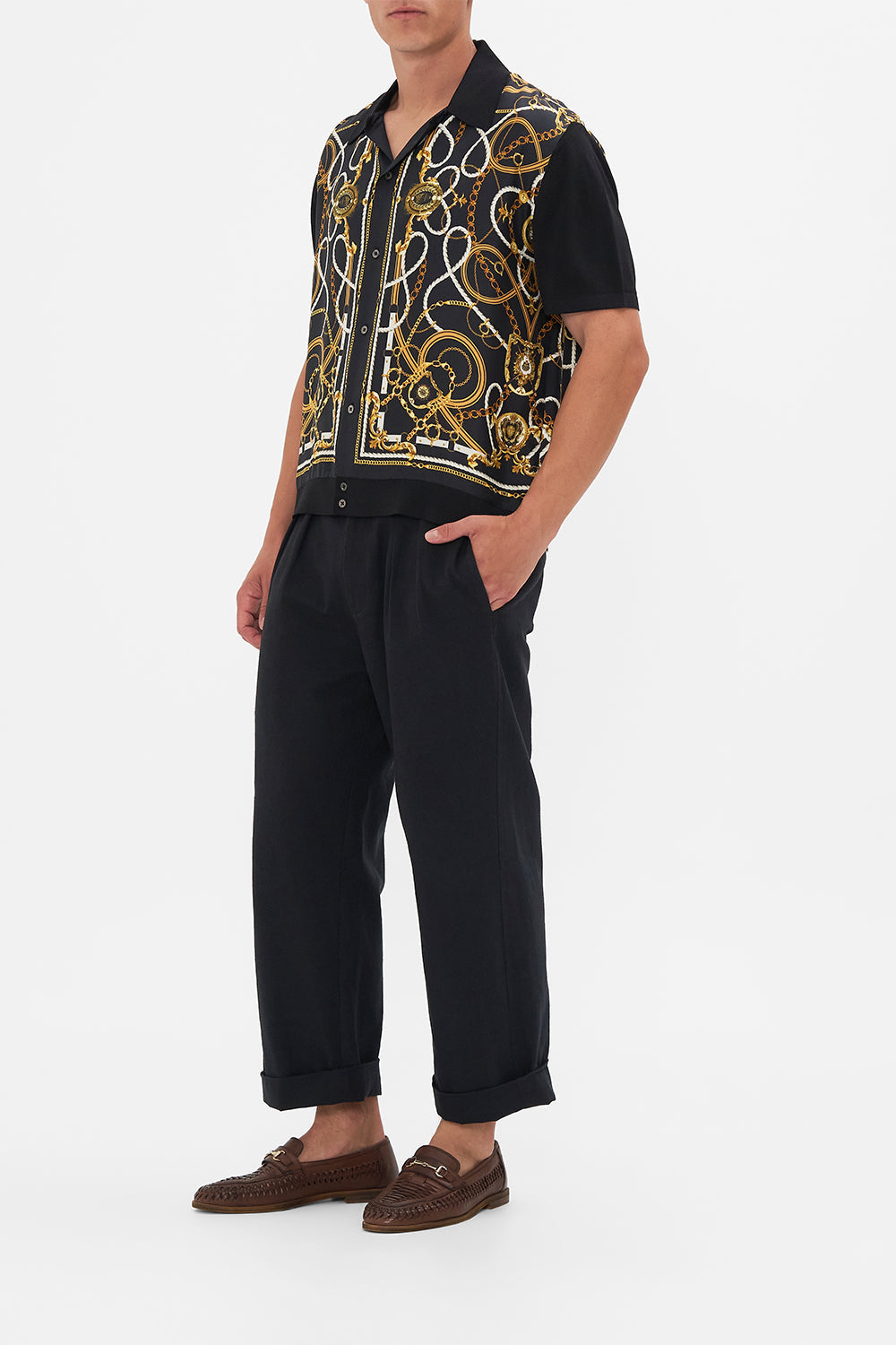 Side view of model wearing Hotel Franks By CAMILLA mens silk shirt in Coast to Coast print