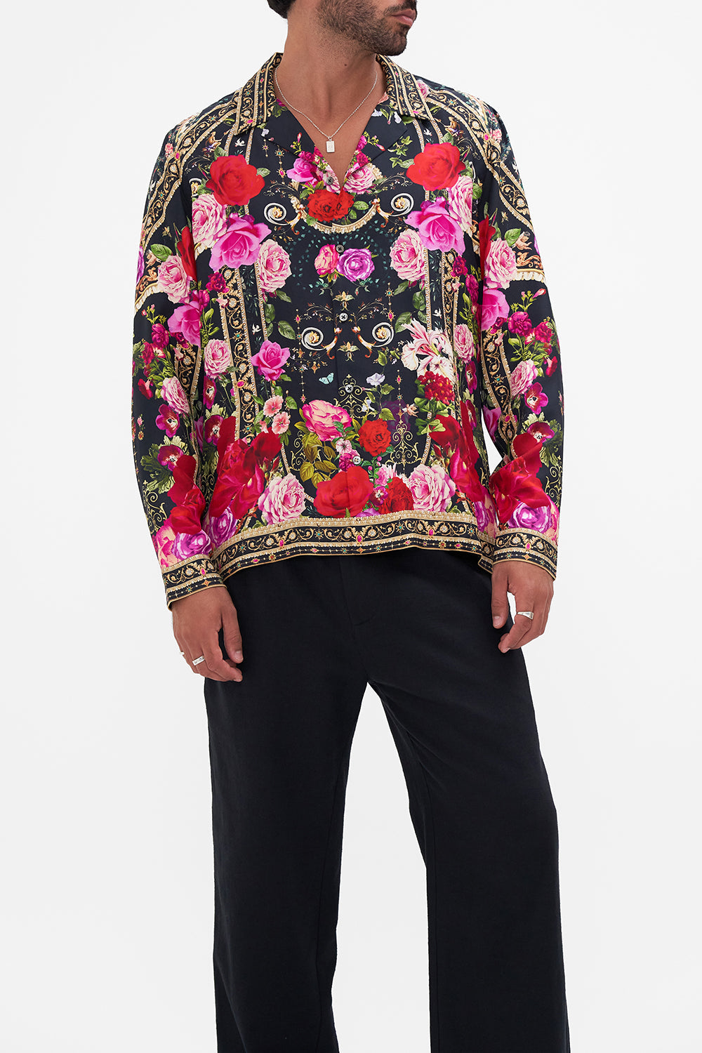 Crop view of model wearing Hotel Franks by CAMILLA mens floral camp collared shirt in Reservation For Love print
