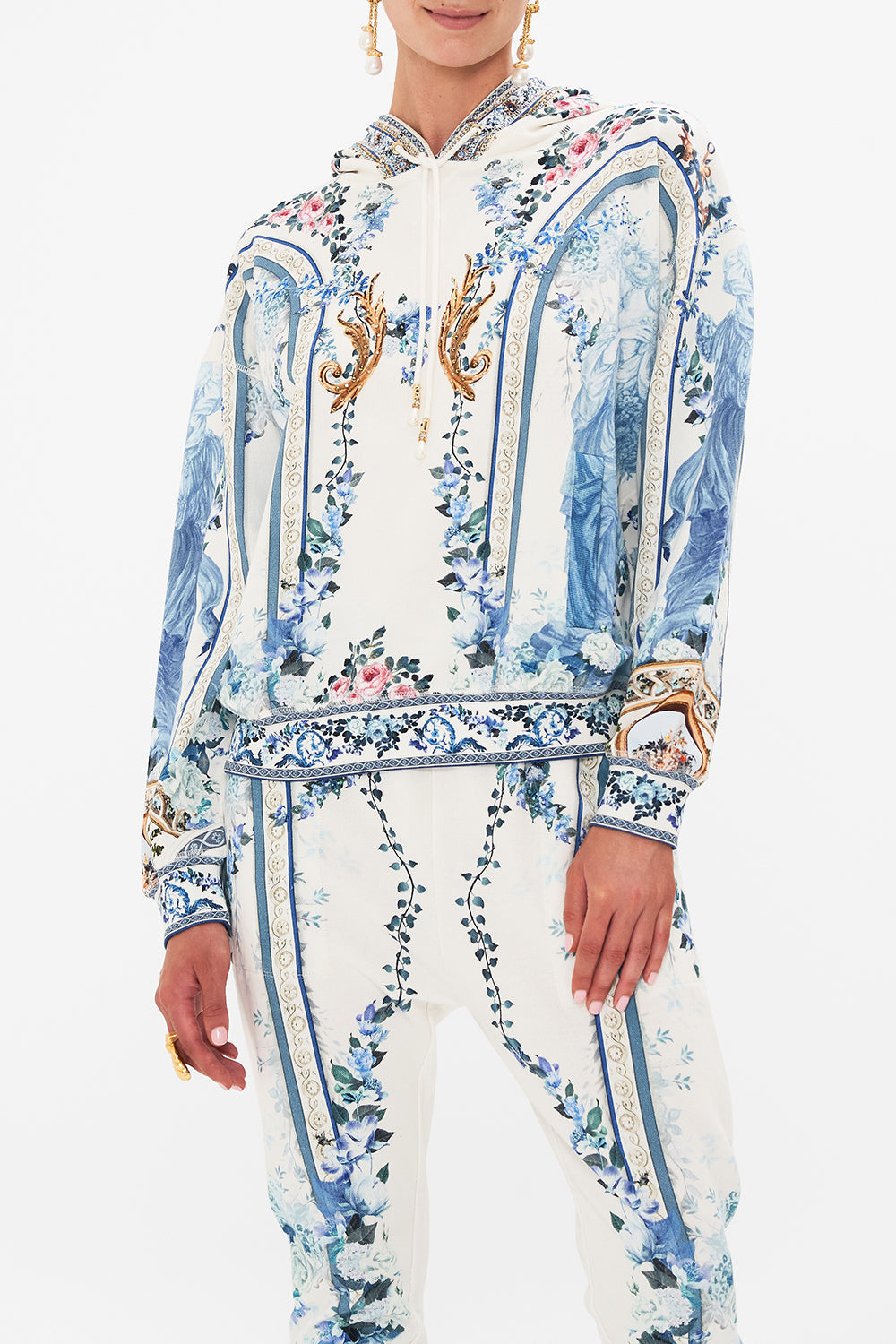 Crop view of model wearing CAMILLA hoodie in Season Of The Siren print