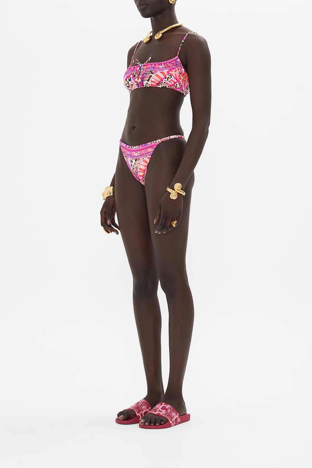 Side view of model wearing CAMILLA designer crop top in Viola Vintage print